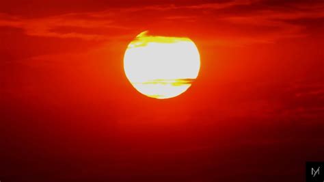 Why is the sunset red or orange? At sunrise and sunset, the Sun is very low in the sky, which means that the sunlight we see has travelled through a much thicker amount of atmosphere. Because blue light is scattered more strongly by the atmosphere, it tends to be scattered several times and deflected away in other directions before it gets to ...